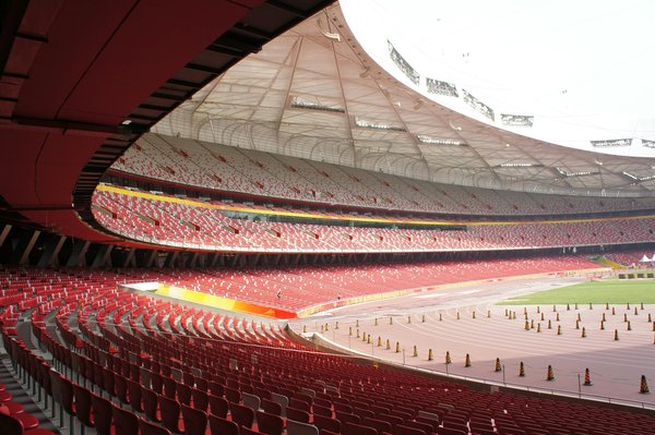 How can grassroots football clubs in the UK attract more female players to the sport?